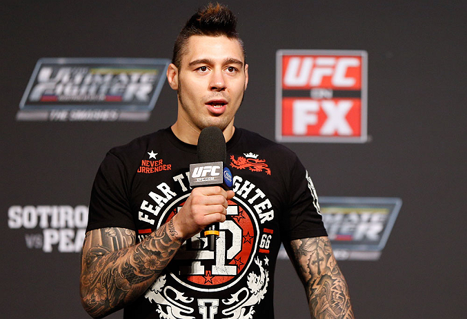 GOLD COAST, AUSTRALIA - DECEMBER 14: UFC welterweight fighter Dan Hardy interacts with fans during a Q&A session before the UFC on FX weigh in on December 14, 2012 at Gold Coast Convention and Exhibition Centre in Gold Coast, Queensland, Australia. (Photo by Josh Hedges/Zuffa LLC/Zuffa LLC via Getty Images)