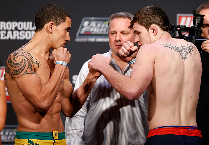 GOLD COAST, AUSTRALIA - DECEMBER 14: (L-R) Opponents Robert Whittaker and Bradley Scott face off during the UFC on FX weigh in on December 14, 2012 at Gold Coast Convention and Exhibition Centre in Gold Coast, Queensland, Australia. (Photo by Josh Hedges/Zuffa LLC/Zuffa LLC via Getty Images)