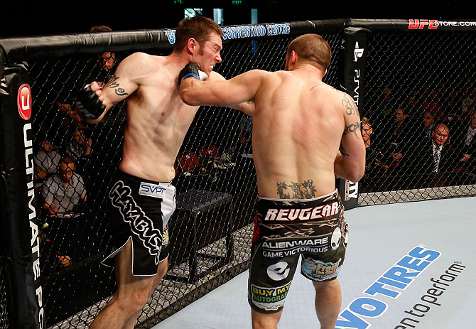 GOLD COAST, AUSTRALIA - DECEMBER 15:  (R-L) Cody Donovan punches Nick Penner during their light heavyweight fight at the UFC on FX event on December 15, 2012  at Gold Coast Convention and Exhibition Centre in Gold Coast, Australia.  (Photo by Josh Hedges/Zuffa LLC/Zuffa LLC via Getty Images)