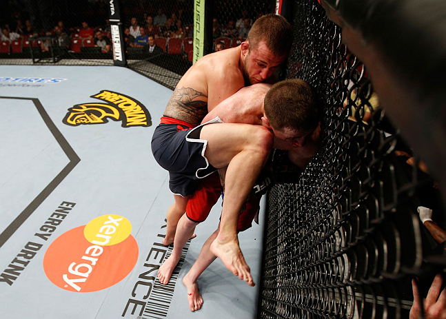 GOLD COAST, AUSTRALIA - DECEMBER 15:  (L-R) Mike Wilkinson knees Brendan Loughnane during their lightweight fight at the UFC on FX event on December 15, 2012  at Gold Coast Convention and Exhibition Centre in Gold Coast, Australia.  (Photo by Josh Hedges/Zuffa LLC/Zuffa LLC via Getty Images)