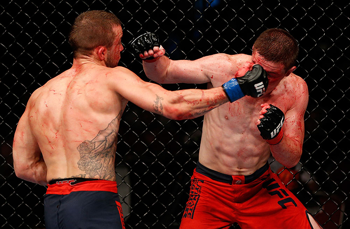 GOLD COAST, AUSTRALIA - DECEMBER 15:  (L-R) Mike Wilkinson punches Brendan Loughnane during their lightweight fight at the UFC on FX event on December 15, 2012  at Gold Coast Convention and Exhibition Centre in Gold Coast, Australia.  (Photo by Josh Hedges/Zuffa LLC/Zuffa LLC via Getty Images)