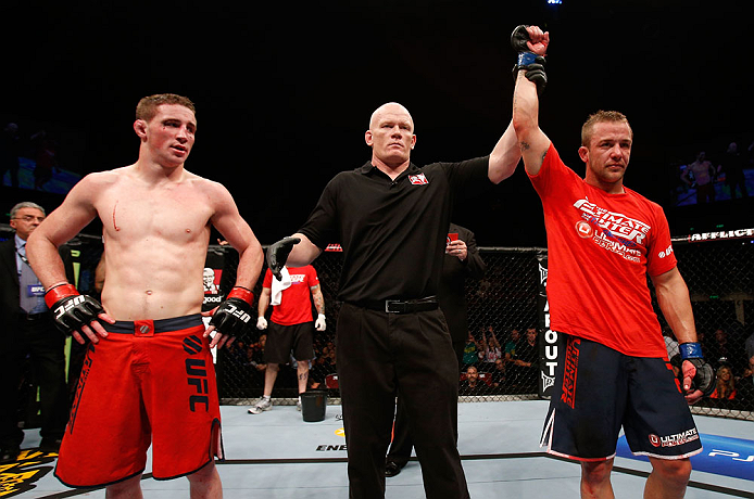 GOLD COAST, AUSTRALIA - DECEMBER 15:  Mike Wilkinson (R) reacts after defeating Brendan Loughnane during their lightweight fight at the UFC on FX event on December 15, 2012  at Gold Coast Convention and Exhibition Centre in Gold Coast, Australia.  (Photo by Josh Hedges/Zuffa LLC/Zuffa LLC via Getty Images)