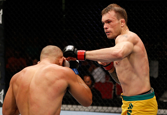 GOLD COAST, AUSTRALIA - DECEMBER 15:  (R-L) Benny Alloway punches Manuel Rodriguez during their welterweight fight at the UFC on FX event on December 15, 2012  at Gold Coast Convention and Exhibition Centre in Gold Coast, Australia.  (Photo by Josh Hedges/Zuffa LLC/Zuffa LLC via Getty Images)