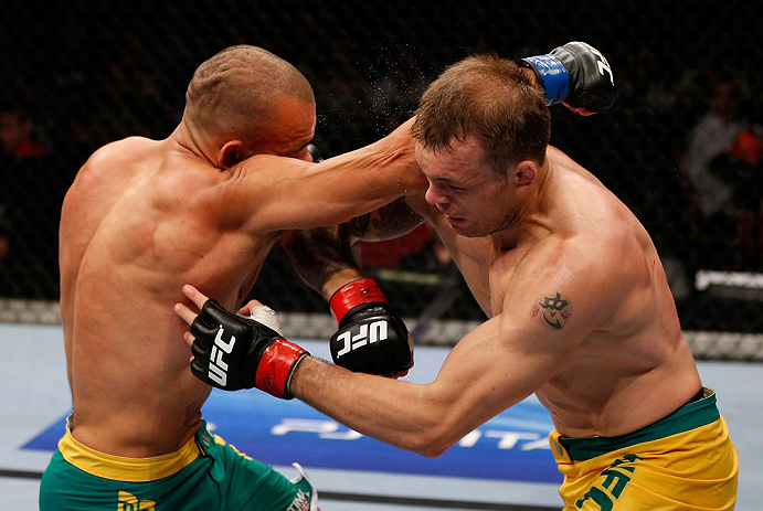 GOLD COAST, AUSTRALIA - DECEMBER 15:  (L-R) Manuel Rodriguez punches Benny Alloway during their welterweight fight at the UFC on FX event on December 15, 2012  at Gold Coast Convention and Exhibition Centre in Gold Coast, Australia.  (Photo by Josh Hedges/Zuffa LLC/Zuffa LLC via Getty Images)
