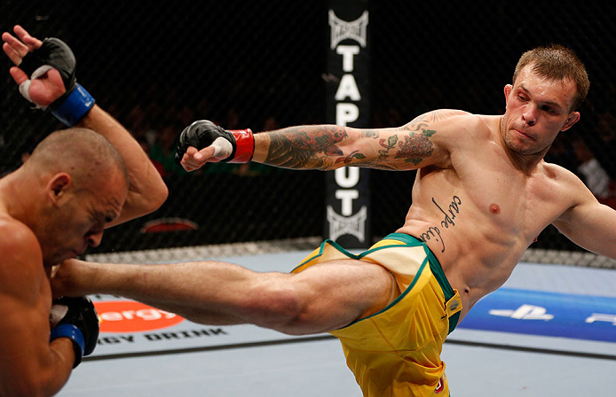 GOLD COAST, AUSTRALIA - DECEMBER 15:  (R-L) Benny Alloway kicks Manuel Rodriguez during their welterweight fight at the UFC on FX event on December 15, 2012  at Gold Coast Convention and Exhibition Centre in Gold Coast, Australia.  (Photo by Josh Hedges/Zuffa LLC/Zuffa LLC via Getty Images)