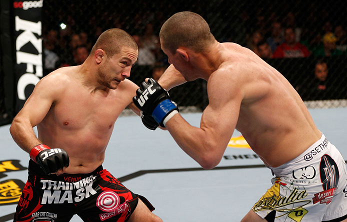 GOLD COAST, AUSTRALIA - DECEMBER 15:  (L-R) Mike Pierce and Seth Baczynski trade punches during their welterweight fight at the UFC on FX event on December 15, 2012  at Gold Coast Convention and Exhibition Centre in Gold Coast, Australia.  (Photo by Josh Hedges/Zuffa LLC/Zuffa LLC via Getty Images)