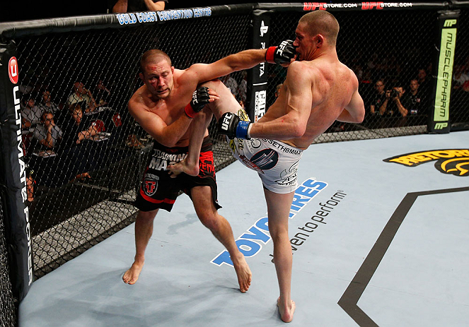 GOLD COAST, AUSTRALIA - DECEMBER 15:  (L-R) Mike Pierce and Seth Baczynski trade strikes during their welterweight fight at the UFC on FX event on December 15, 2012  at Gold Coast Convention and Exhibition Centre in Gold Coast, Australia.  (Photo by Josh Hedges/Zuffa LLC/Zuffa LLC via Getty Images)