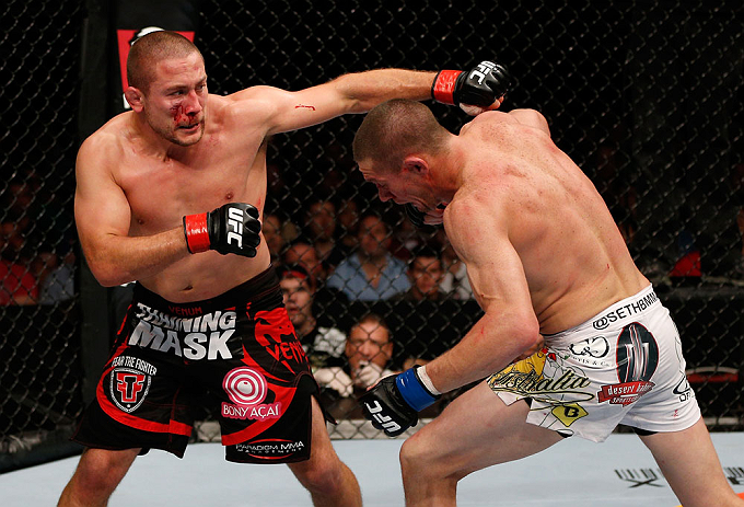 GOLD COAST, AUSTRALIA - DECEMBER 15:  (L-R) Mike Pierce punches Seth Baczynski during their welterweight fight at the UFC on FX event on December 15, 2012  at Gold Coast Convention and Exhibition Centre in Gold Coast, Australia.  (Photo by Josh Hedges/Zuffa LLC/Zuffa LLC via Getty Images)