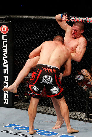 GOLD COAST, AUSTRALIA - DECEMBER 15:  (L-R) Mike Pierce takes down Seth Baczynski during their welterweight fight at the UFC on FX event on December 15, 2012  at Gold Coast Convention and Exhibition Centre in Gold Coast, Australia.  (Photo by Josh Hedges/Zuffa LLC/Zuffa LLC via Getty Images)