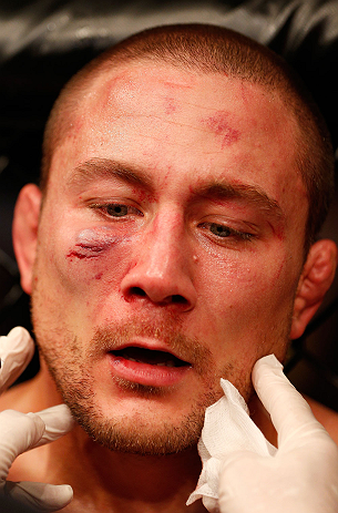 GOLD COAST, AUSTRALIA - DECEMBER 15:  Mike Pierce is examined by a doctor after his three-round welterweight bout against Seth Baczynski at the UFC on FX event on December 15, 2012  at Gold Coast Convention and Exhibition Centre in Gold Coast, Australia.  (Photo by Josh Hedges/Zuffa LLC/Zuffa LLC via Getty Images)