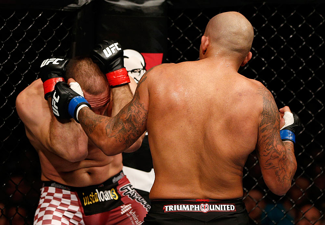 GOLD COAST, AUSTRALIA - DECEMBER 15:  (R-L) Joey Beltran punches Igor Pokrajac during their light heavyweight fight at the UFC on FX event on December 15, 2012  at Gold Coast Convention and Exhibition Centre in Gold Coast, Australia.  (Photo by Josh Hedges/Zuffa LLC/Zuffa LLC via Getty Images)