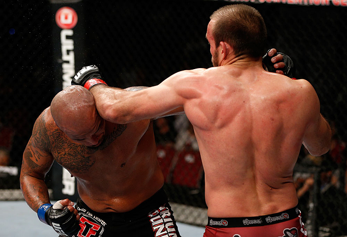 GOLD COAST, AUSTRALIA - DECEMBER 15:  (R-L) Igor Pokrajac and Joey Beltran trade punches during their light heavyweight fight at the UFC on FX event on December 15, 2012  at Gold Coast Convention and Exhibition Centre in Gold Coast, Australia.  (Photo by Josh Hedges/Zuffa LLC/Zuffa LLC via Getty Images)