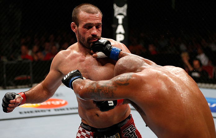 GOLD COAST, AUSTRALIA - DECEMBER 15:  (R-L) Joey Beltran punches Igor Pokrajac during their light heavyweight fight at the UFC on FX event on December 15, 2012  at Gold Coast Convention and Exhibition Centre in Gold Coast, Australia.  (Photo by Josh Hedges/Zuffa LLC/Zuffa LLC via Getty Images)