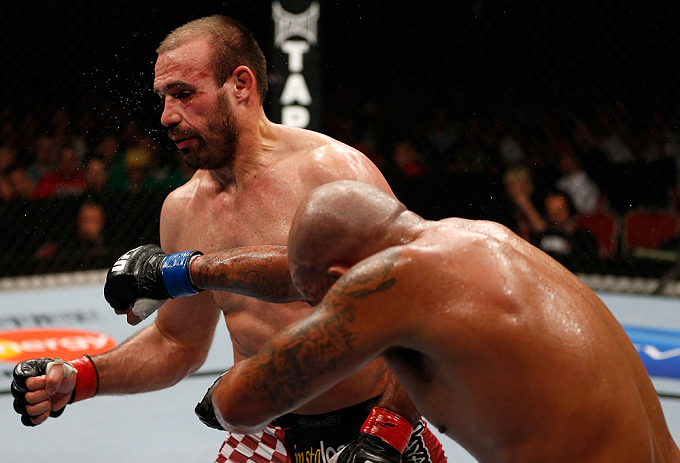 GOLD COAST, AUSTRALIA - DECEMBER 15:  (R-L) Joey Beltran punches Igor Pokrajac during their light heavyweight fight at the UFC on FX event on December 15, 2012  at Gold Coast Convention and Exhibition Centre in Gold Coast, Australia.  (Photo by Josh Hedges/Zuffa LLC/Zuffa LLC via Getty Images)