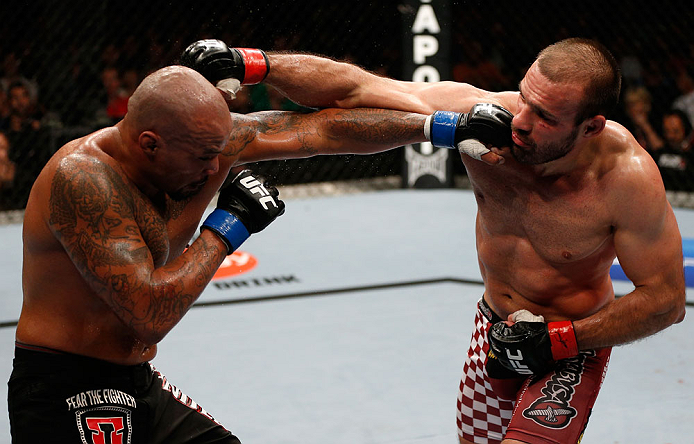 GOLD COAST, AUSTRALIA - DECEMBER 15:  (L-R) Joey Beltran punches Igor Pokrajac during their light heavyweight fight at the UFC on FX event on December 15, 2012  at Gold Coast Convention and Exhibition Centre in Gold Coast, Australia.  (Photo by Josh Hedges/Zuffa LLC/Zuffa LLC via Getty Images)