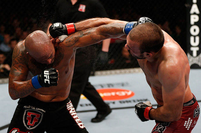 GOLD COAST, AUSTRALIA - DECEMBER 15:  (R-L) Igor Pokrajac and Joey Beltran trade punches during their light heavyweight fight at the UFC on FX event on December 15, 2012  at Gold Coast Convention and Exhibition Centre in Gold Coast, Australia.  (Photo by Josh Hedges/Zuffa LLC/Zuffa LLC via Getty Images)