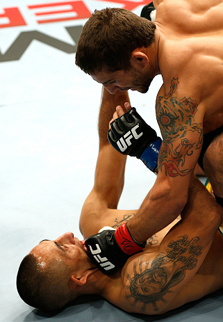 GOLD COAST, AUSTRALIA - DECEMBER 15:  (R-L) Chad Mendes knocks out Yaotzin Meza with punches during their featherweight fight at the UFC on FX event on December 15, 2012  at Gold Coast Convention and Exhibition Centre in Gold Coast, Australia.  (Photo by Josh Hedges/Zuffa LLC/Zuffa LLC via Getty Images)