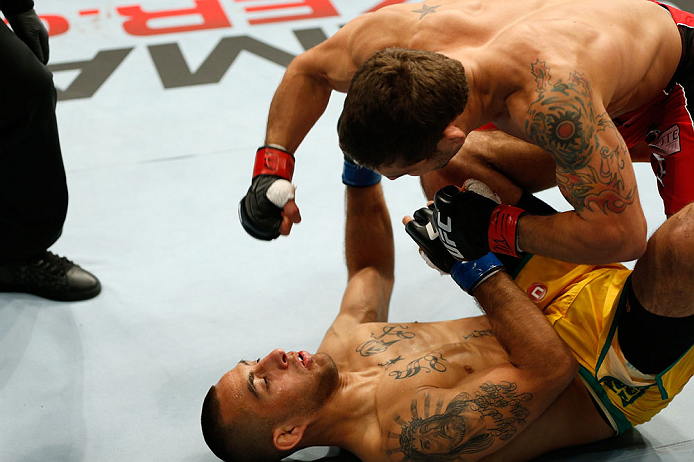 GOLD COAST, AUSTRALIA - DECEMBER 15:  (R-L) Chad Mendes knocks out Yaotzin Meza with punches during their featherweight fight at the UFC on FX event on December 15, 2012  at Gold Coast Convention and Exhibition Centre in Gold Coast, Australia.  (Photo by Josh Hedges/Zuffa LLC/Zuffa LLC via Getty Images)
