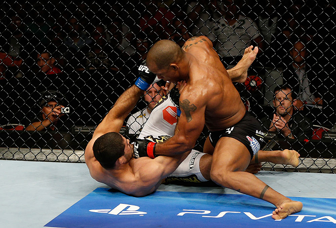 GOLD COAST, AUSTRALIA - DECEMBER 15:  (R-L) Hector Lombard punches Rousimar Palhares during their middleweight fight at the UFC on FX event on December 15, 2012  at Gold Coast Convention and Exhibition Centre in Gold Coast, Australia.  (Photo by Josh Hedges/Zuffa LLC/Zuffa LLC via Getty Images)