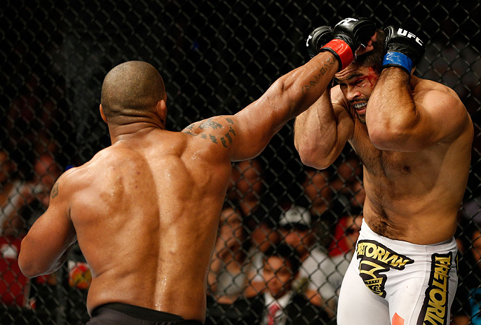 GOLD COAST, AUSTRALIA - DECEMBER 15:  (L-R) Hector Lombard punches Rousimar Palhares during their middleweight fight at the UFC on FX event on December 15, 2012  at Gold Coast Convention and Exhibition Centre in Gold Coast, Australia.  (Photo by Josh Hedges/Zuffa LLC/Zuffa LLC via Getty Images)