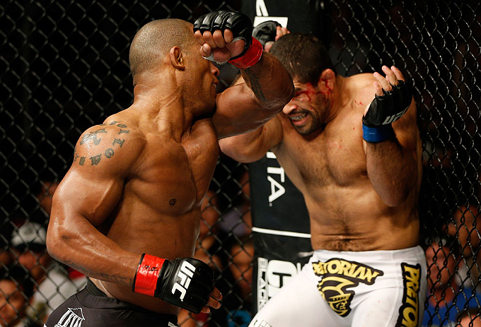 GOLD COAST, AUSTRALIA - DECEMBER 15:  (L-R) Hector Lombard punches Rousimar Palhares during their middleweight fight at the UFC on FX event on December 15, 2012  at Gold Coast Convention and Exhibition Centre in Gold Coast, Australia.  (Photo by Josh Hedges/Zuffa LLC/Zuffa LLC via Getty Images)