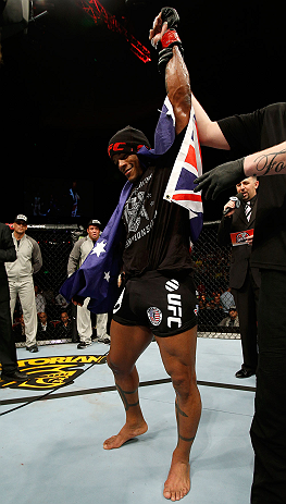 GOLD COAST, AUSTRALIA - DECEMBER 15:  Hector Lombard reacts after knocking out Rousimar Palhares during their middleweight fight at the UFC on FX event on December 15, 2012  at Gold Coast Convention and Exhibition Centre in Gold Coast, Australia.  (Photo by Josh Hedges/Zuffa LLC/Zuffa LLC via Getty Images)