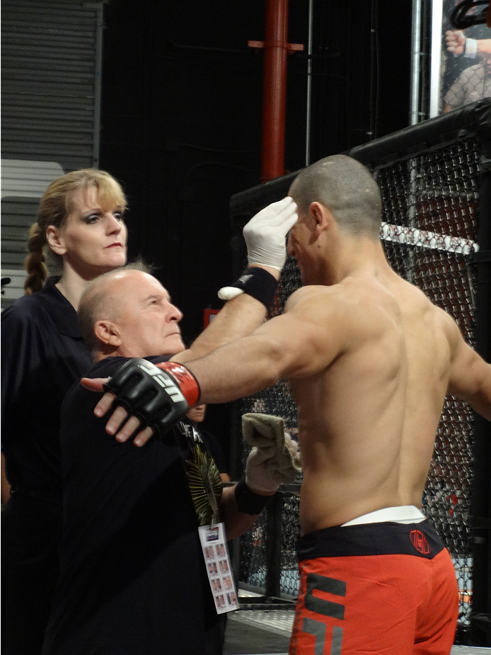 Nordine Taleb gets worked on before stepping into the Octagon.