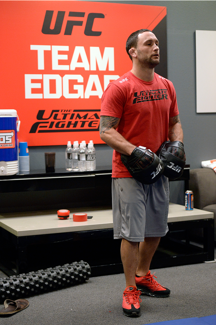 LAS VEGAS, NV - OCTOBER 24: Coach Frankie Edgar trains his fighter Hector Urbina before facing Team Penn fighter Cathal Pendred in their preliminary fight during filming of season nineteen of The Ultimate Fighter on October 24, 2013 in Las Vegas, Nevada. (Photo by Jeff Bottari/Zuffa LLC/Zuffa LLC via Getty Images) *** Local Caption *** Frankie Edgar