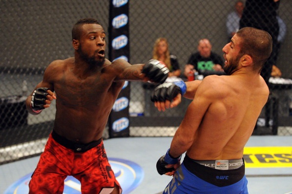 Kakai dodges a blow from Beal Kakai dodges a blow from Beal