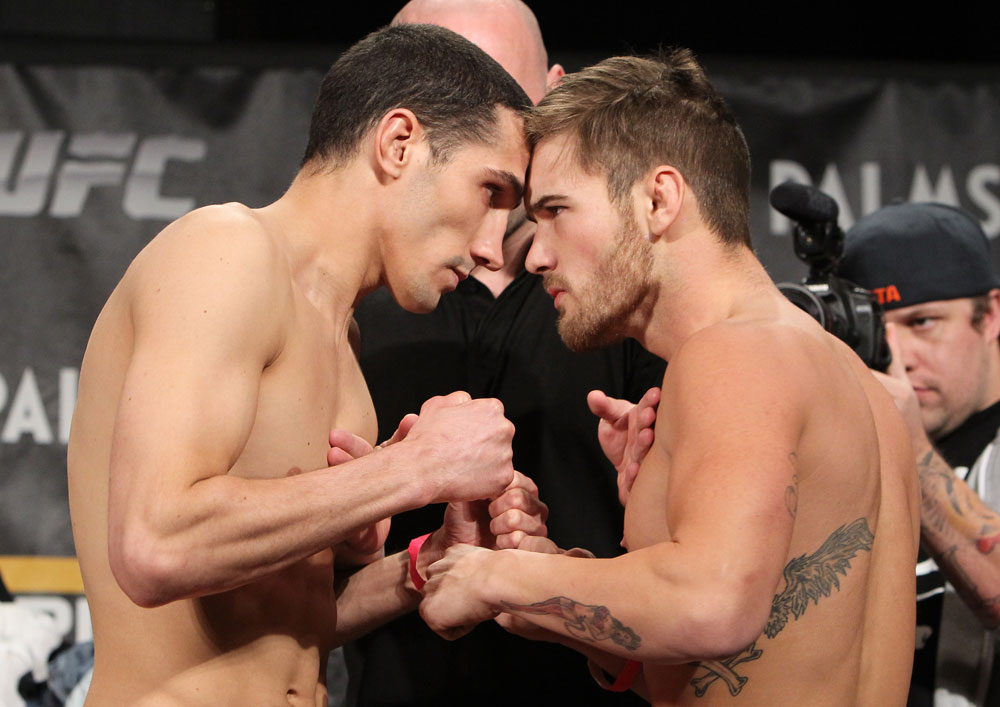 LAS VEGAS, NV - DECEMBER 02:  (L-R) Opponents Roland Delorme and Josh Ferguson face off after weighing in at the official weigh-in for The Ultimate Fighter 14 Finale at The Palms Casino Resort on December 2, 2011 in Las Vegas, Nevada.  (Photo by Josh Hedges/Zuffa LLC/Zuffa LLC via Getty Images)