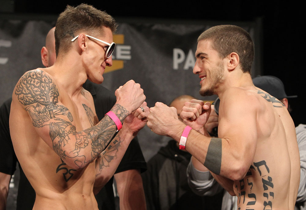 LAS VEGAS, NV - DECEMBER 02:  (L-R) Opponents Dustin Pague and John Albert face off after weighing in at the official weigh-in for The Ultimate Fighter 14 Finale at The Palms Casino Resort on December 2, 2011 in Las Vegas, Nevada.  (Photo by Josh Hedges/Zuffa LLC/Zuffa LLC via Getty Images)