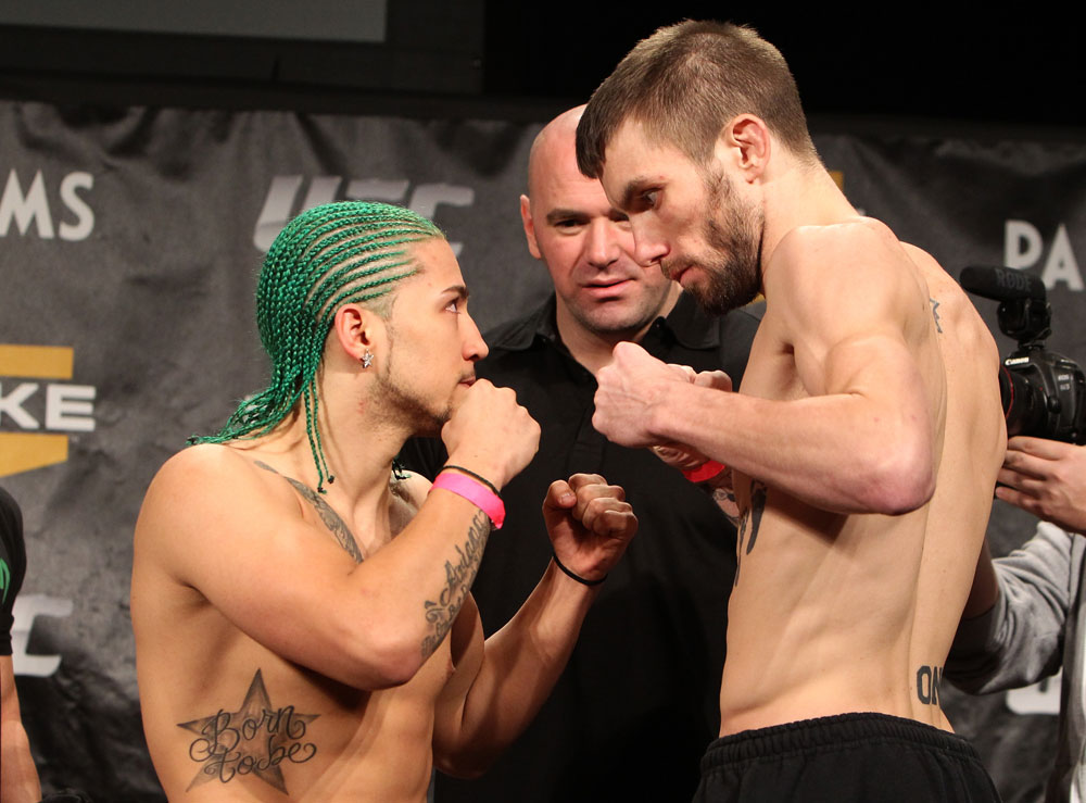 LAS VEGAS, NV - DECEMBER 02:  (L-R) Bantamweight opponents Louis Gaudinot and Johny Bedford face off after weighing in at the official weigh-in for The Ultimate Fighter 14 Finale at The Palms Casino Resort on December 2, 2011 in Las Vegas, Nevada.  (Photo by Josh Hedges/Zuffa LLC/Zuffa LLC via Getty Images)