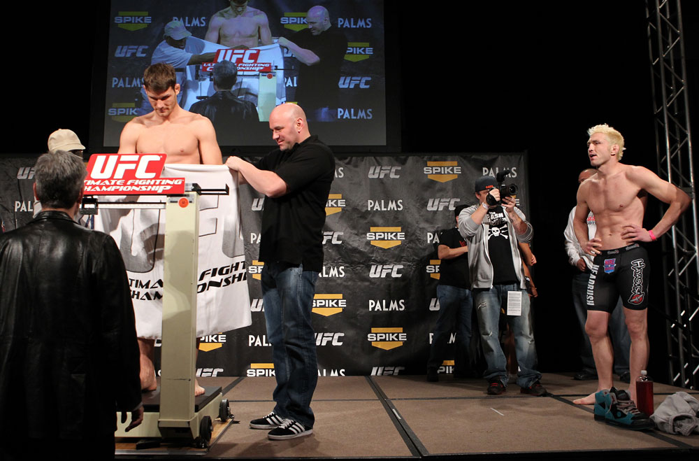 LAS VEGAS, NV - DECEMBER 02:  Michael Bisping (L) weighs in as his opponent Jason Miller (R) looks on at the official weigh-in for The Ultimate Fighter 14 Finale at The Palms Casino Resort on December 2, 2011 in Las Vegas, Nevada.  (Photo by Josh Hedges/Zuffa LLC/Zuffa LLC via Getty Images)