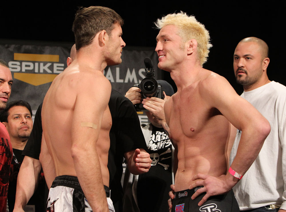 LAS VEGAS, NV - DECEMBER 02:  (L-R) Middleweight opponents Michael Bisping and Jason "Mayhem" Miller face off after weighing in at the official weigh-in for The Ultimate Fighter 14 Finale at The Palms Casino Resort on December 2, 2011 in Las Vegas, Nevada.  (Photo by Josh Hedges/Zuffa LLC/Zuffa LLC via Getty Images)