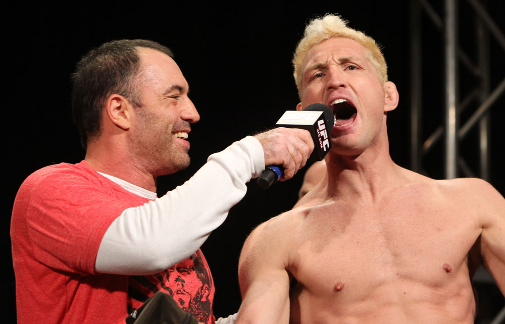 LAS VEGAS, NV - DECEMBER 02:  (R-L) Jason "Mayhem" Miller is interviewed by Joe Rogan after weighing in at the official weigh-in for The Ultimate Fighter 14 Finale at The Palms Casino Resort on December 2, 2011 in Las Vegas, Nevada.  (Photo by Josh Hedges/Zuffa LLC/Zuffa LLC via Getty Images)