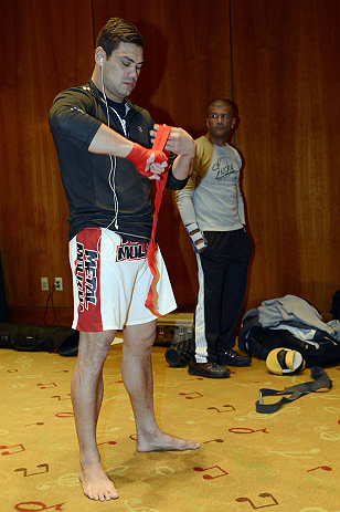 LAS VEGAS, NV - DECEMBER 13: UFC fighter Shane Del Rosario wraps his hands before working out for the media during the Ultimate Fighter 16 Finale open workouts at The Joint at the Hard Rock Hotel and Casino on December 13, 2012 in Las Vegas, Nevada.  (Photo by Jeff Bottari/Zuffa LLC/Zuffa LLC)