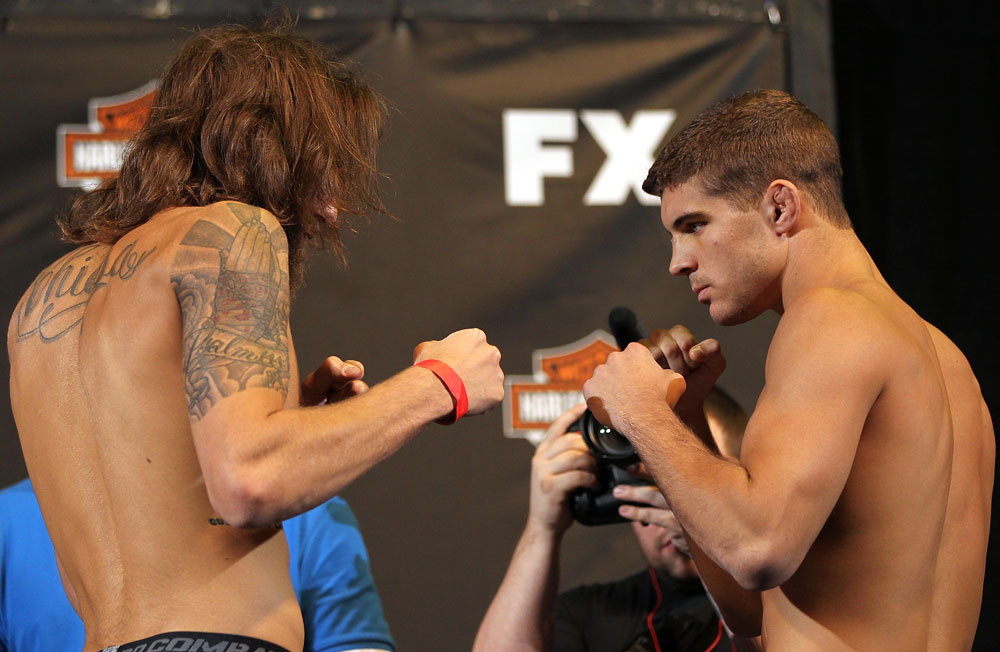 LAS VEGAS, NV - MAY 31:   (L-R) Opponents Michael Chiesa and Al Iaquinta face off after making weight during The Ultimate Fighter Live weigh in at the Palms Casino Resort on May 31, 2012 in Las Vegas, Nevada.  (Photo by Josh Hedges/Zuffa LLC/Zuffa LLC via Getty Images)  *** Local Caption *** Michael Chiesa; Al Iaquinta