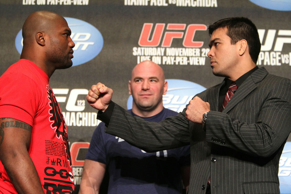Quinton "Rampage" Jackson (L) and Lyoto "The Dragon" Machida (R) face off as UFC President Dana White looks on at the UFC 123 pre-fight press conference at the MGM Grand Hotel and Casino in Detroit, Michigan on November 17, 2010 (Photo by Josh Hedges/Zuffa LLC/Zuffa LLC vi