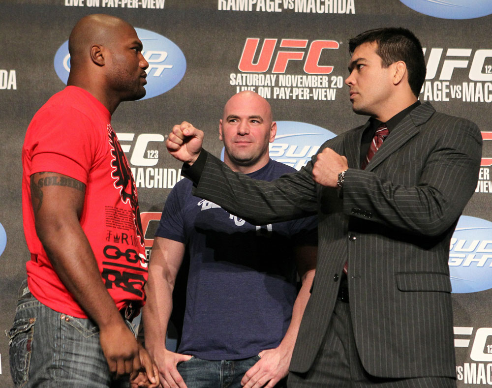 Quinton "Rampage" Jackson (L) and Lyoto "The Dragon" Machida (R) face off as UFC President Dana White looks on at the UFC 123 pre-fight press conference at the MGM Grand Hotel and Casino in Detroit, Michigan on November 17, 2010 (Photo by Josh Hedges/Zuffa LLC/Zuffa LLC via