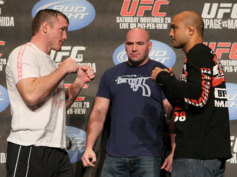 Matt Hughes (L) and BJ Penn (R) face off as UFC President Dana White looks on at the UFC 123 pre-fight press conference at the MGM Grand Hotel and Casino in Detroit, Michigan on November 17, 2010  (Photo by Josh Hedges/Zuffa LLC/Zuffa LLC via Getty Images)