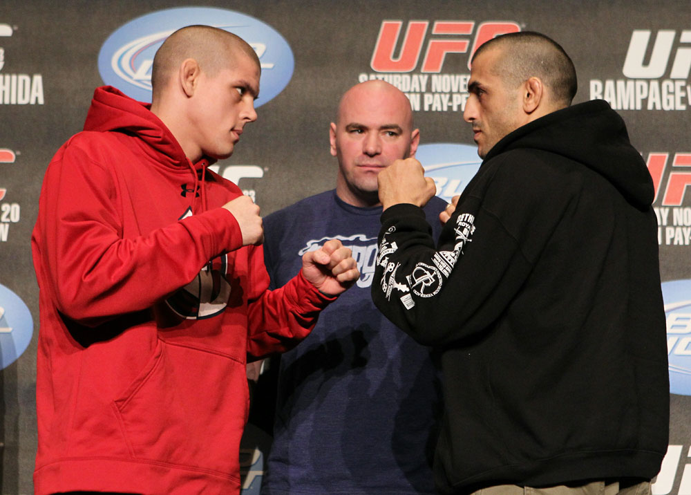 Joe Lauzon (L) and George Sotiropoulos (R) face off as UFC President Dana White looks on at the UFC 123 pre-fight press conference at the MGM Grand Hotel and Casino in Detroit, Michigan on November 17, 2010 (Photo by Josh Hedges/Zuffa LLC/Zuffa LLC via Getty Images)