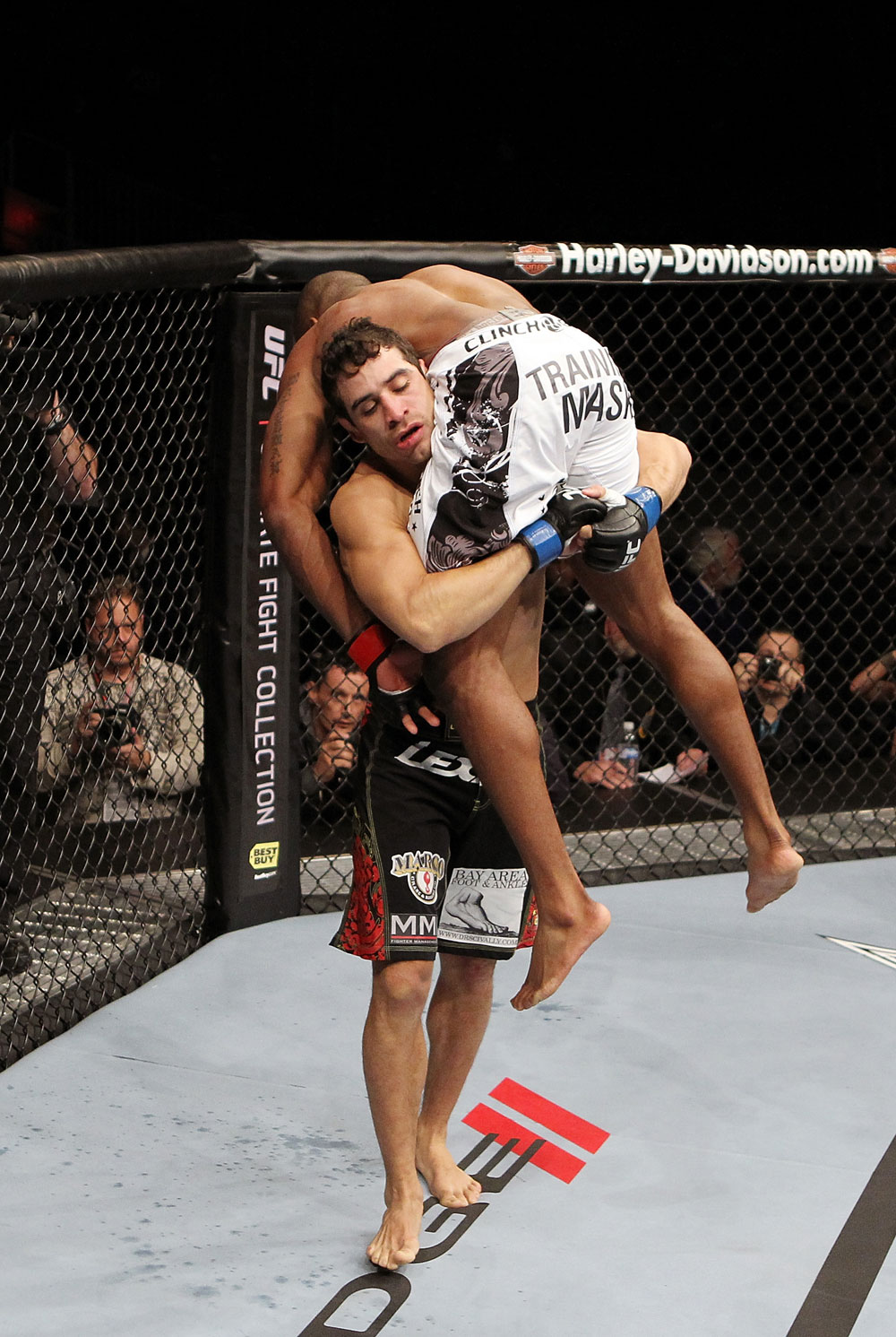 SAN JOSE, CA - NOVEMBER 19: (L-R) Danny Castillo picks up Shamar Bailey to slam him to the mat during a UFC Lightweight bout at the HP Pavillion on November 19, 2011 in San Jose, California. (Photo by Josh Hedges/Zuffa LLC/Zuffa LLC via Getty Images)