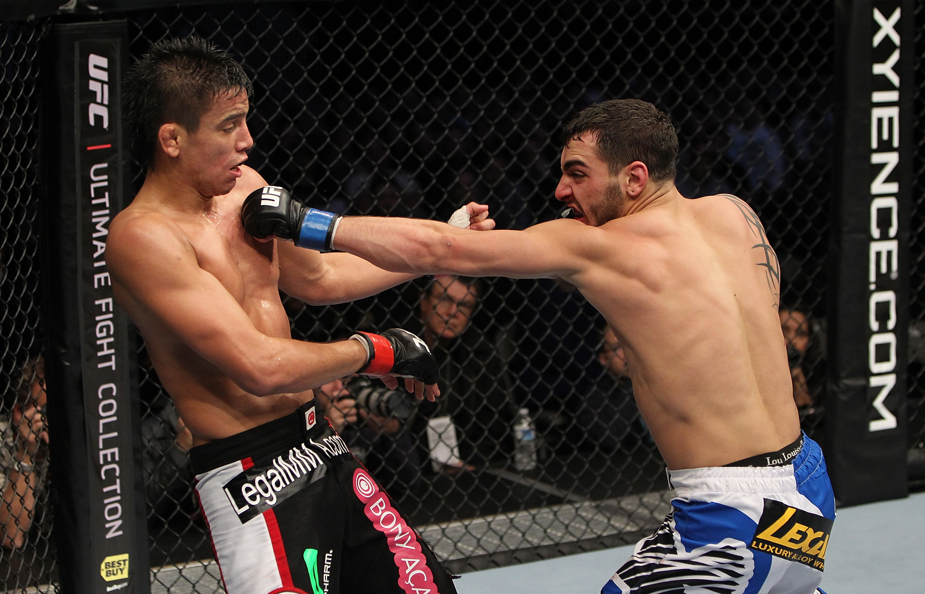SAN JOSE, CA - NOVEMBER 19: (R-L) Nick Pace punches Miguel Torres during an UFC Bantamweight bout at the HP Pavilion in San Jose, California on November 19, 2011 in San Jose, California. (Photo by Josh Hedges/Zuffa LLC/Zuffa LLC via Getty Images)