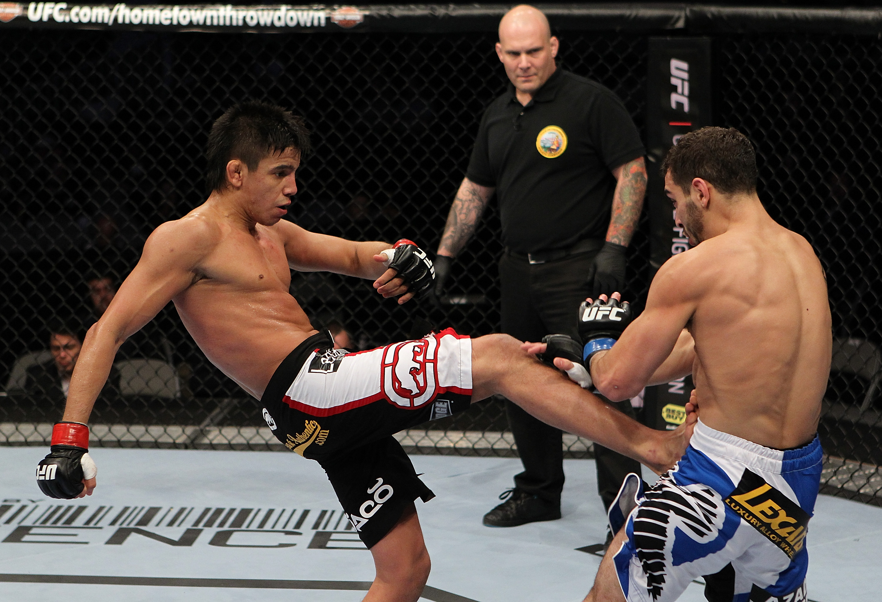 SAN JOSE, CA - NOVEMBER 19: (L-R) Miguel Torres kicks Nick Pace during an UFC Bantamweight bout at the HP Pavillion in San Jose, California on November 19, 2011 in San Jose, California. (Photo by Josh Hedges/Zuffa LLC/Zuffa LLC via Getty Images)