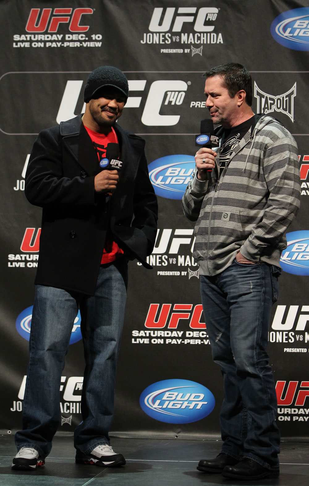 TORONTO, ON - DECEMBER 09:  (L-R) UFC Middleweight contender Mark Munoz and UFC commentator Mike Goldberg interacts with fans during a Q&A session before the UFC 140 Official Weigh-in at the Air Canada Centre on December 9, 2011 in Toronto, Canada.  (Photo by Josh Hedges/Zuffa LLC/Zuffa LLC via Getty Images)