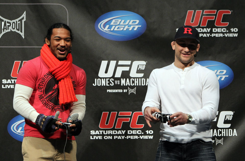 TORONTO, ON - DECEMBER 09:  (R-L) UFC Lightweight Champion Frankie Edgar and challenger Benson Henderson battle each other on the UFC Undisputed 3 videogame before the UFC 140 Official Weigh-in at the Air Canada Centre on December 9, 2011 in Toronto, Canada.  (Photo by Josh Hedges/Zuffa LLC/Zuffa LLC via Getty Images)