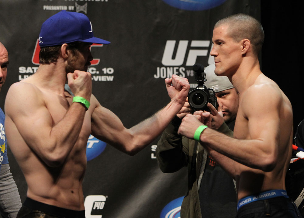 TORONTO, ON - DECEMBER 09:  (L-R)  Opponents Mitch Clarke and John Cholish face off after weighing in during the UFC 140 Official Weigh-in at the Air Canada Centre on December 9, 2011 in Toronto, Canada.  (Photo by Josh Hedges/Zuffa LLC/Zuffa LLC via Getty Images)