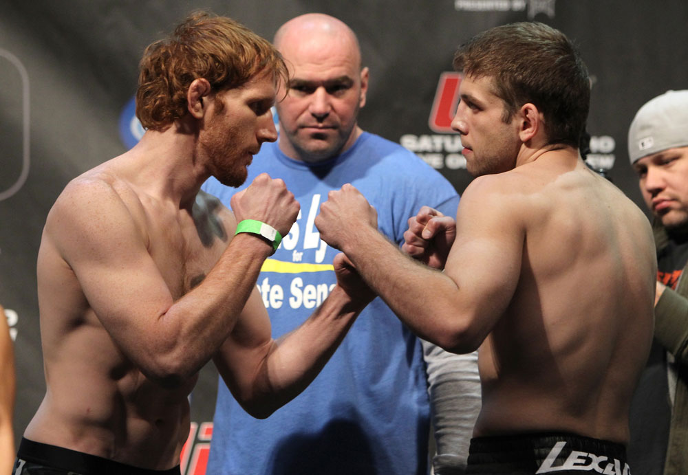 TORONTO, ON - DECEMBER 09:  (L-R) Lightweight opponentsMark Bocek and Nik Lentz face off after weighing in during the UFC 140 Official Weigh-in at the Air Canada Centre on December 9, 2011 in Toronto, Canada.  (Photo by Josh Hedges/Zuffa LLC/Zuffa LLC via Getty Images)