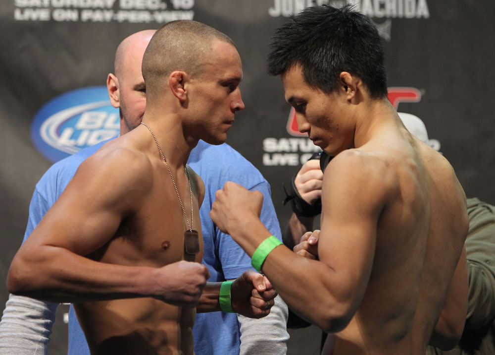 TORONTO, ON - DECEMBER 09:  (L-R) Featherweight opponents Mark Hominick and Chan Sung Jung face off after weighing in during the UFC 140 Official Weigh-in at the Air Canada Centre on December 9, 2011 in Toronto, Canada.  (Photo by Josh Hedges/Zuffa LLC/Zuffa LLC via Getty Images)