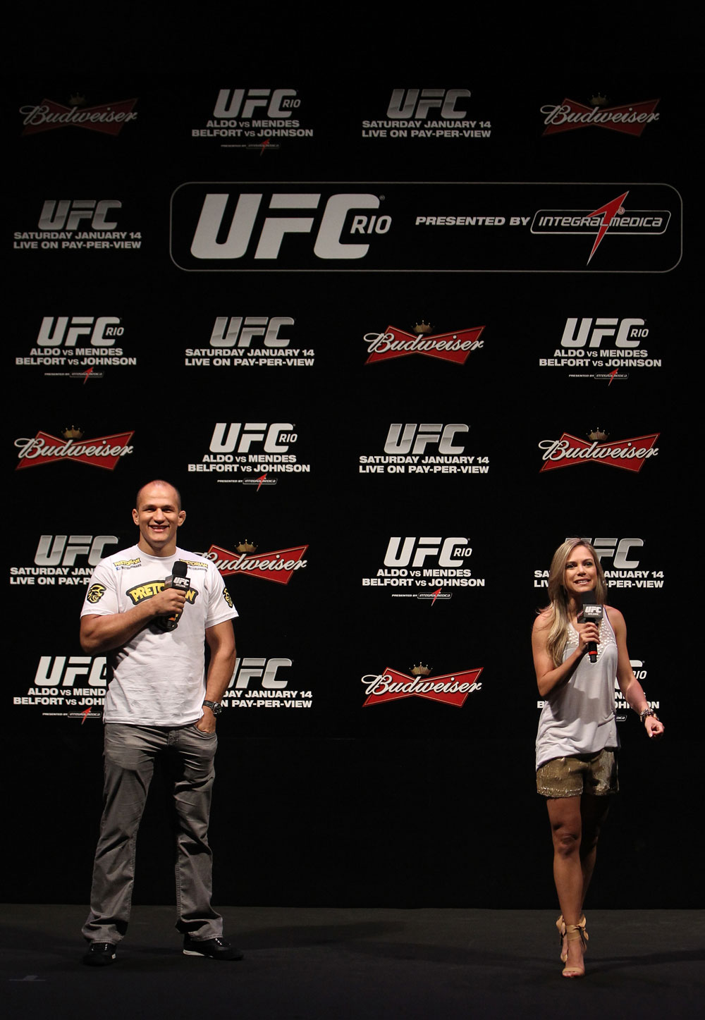 RIO DE JANEIRO, BRAZIL - JANUARY 13: (L-R) UFC Heavyweight Champion Junior dos Santos and UFC host Paula Sack interact with fans during a Q&A session before the UFC 142 Weigh In at HSBC Arena on January 13, 2012 in Rio de Janeiro, Brazil. (Photo by Josh Hedges/Zuffa LLC/Zuffa LLC via Getty Images)